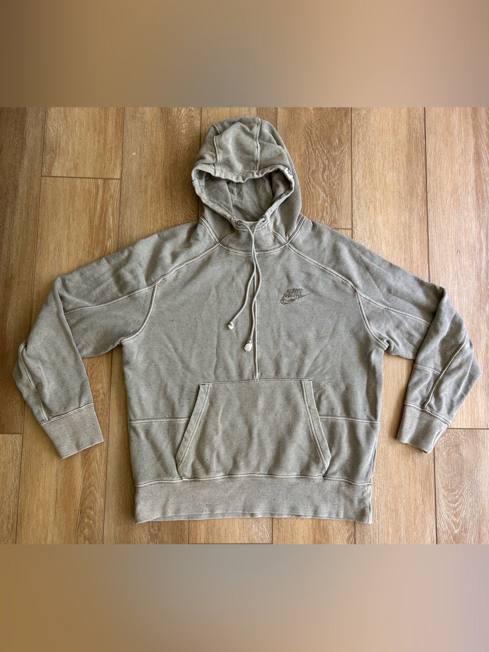 Nike Club Washed Hoodie in a faded gray/ beige with subtle multicolored speckles